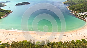 Aerial view of beautiful tropical beach and sea with palm and other tree in Phuket island for travel and vacation. Nai Han Beach