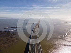 Aerial view of beautiful Vasco da Gama bridge`s suspended highway road crossing the Tagus river, one of the world`s longest brid