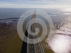Aerial view of beautiful Vasco da Gama bridge`s suspended highway road crossing the Tagus river, one of the world`s longest brid
