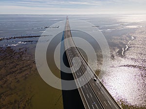 Aerial view of beautiful Vasco da Gama bridge`s suspended highway road crossing the Tagus river, one of the world`s longest brid