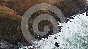 Aerial view of the beautiful waterfall at the coast at Malin Beg looking in County Donegal, Ireland.