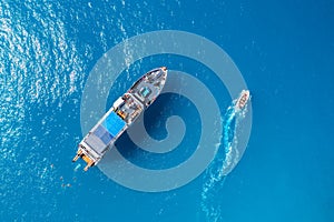 Aerial view of beautiful yacht and boat on the sea at sunset