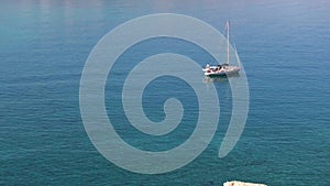 Aerial view of beautiful yacht. Boat on the sea at sunset in summer.