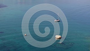 Aerial view of beautiful yacht. Boat on the sea at sunset in summer.