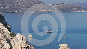 Aerial view of beautiful yacht. Boat on the sea at sunset in summer.