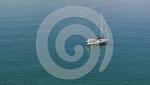 Aerial view of beautiful yacht. Boat on the sea at sunset in summer.