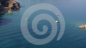 Aerial view of beautiful yacht. Boat on the sea at sunset in summer.