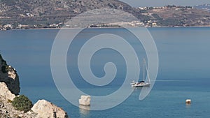 Aerial view of beautiful yacht. Boat on the sea at sunset in summer.