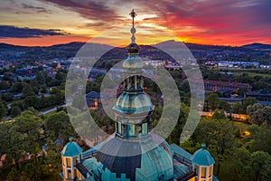 Aerial view of beautifully decorated tower on the roof of a baroque church in Jelenia Gora. Temple surrounded by Karkonosze