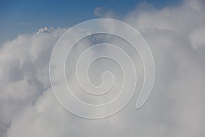 Aerial View Beauty white clouds on blue sky with soft sun light, Nature view fluffy clouds on pastel blue sky background