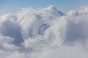 Aerial View Beauty white clouds on blue sky with soft sun light, Nature view fluffy clouds on pastel blue sky background