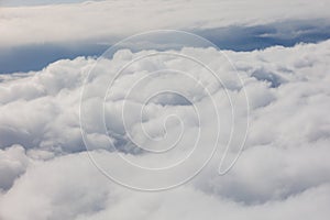 Aerial View Beauty white clouds on blue sky with soft sun light, Nature view fluffy clouds on pastel blue sky background