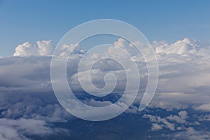 Aerial View Beauty white clouds on blue sky with soft sun light, Nature view fluffy clouds on pastel blue sky background