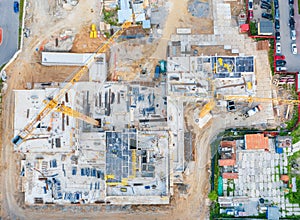 Aerial view of the beginning of the construction of the house, laying the foundation. Construction crane. View from above exactly