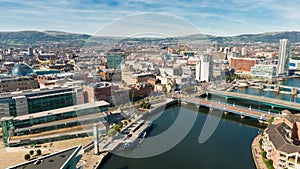 Aerial view of Belfast  in Northern Ireland at Night. Sunset above City, mountains or hills on backgroundFootpath between trees in