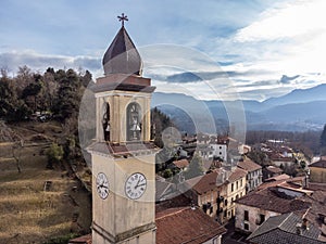 Aerial view of the bell tower of the Ippolito and Cassiano church in Cassano Valcuvia, province of Varese, Italy photo