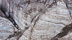 Aerial view of Belvedere glacier, deep and old crevasses, ice in belvedere valley, around mountains