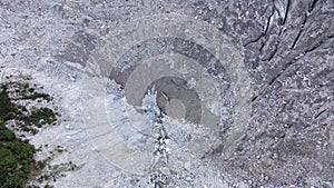 Aerial view of Belvedere glacier, deep and old crevasses, ice in belvedere valley, around mountains