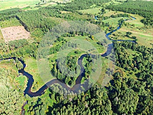 Aerial view of the bends and loops of the Merkys river in Lithuania. Valkininkai environs, Europe.