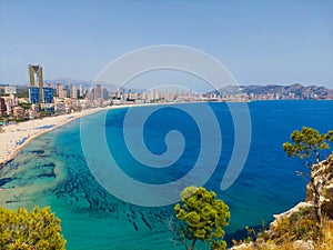 Aerial view of Benidorm, in Spain, with its towering skyscrapers and Poninete beach in front