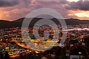 Aerial view of Bergen, Norway at night. Colorful cloudy sunset sky