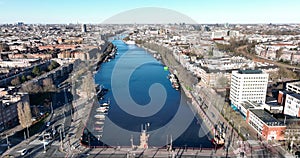 Aerial view of the Berlage brug in Amsterdam, The Netherlands. The Amstel river crossing infrastructure. tram and