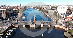 Aerial view of the Berlage brug in Amsterdam, The Netherlands. The Amstel river crossing infrastructure. tram and