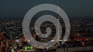 AERIAL: View of Berlin Germany TV Tower Alexanderplatz at Night with City Lights traffic