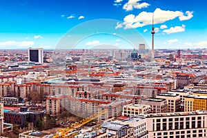 Aerial view of Berlin skyline with famous TV tower at Alexanderplatz and blue sky in Germany