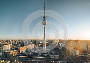 Aerial view of Berlin skyline with famous TV tower at Alexanderplatz in Mitte with pink sky at sunset.