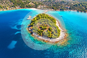 Aerial view of beutiful small island in sea bay at sunny day