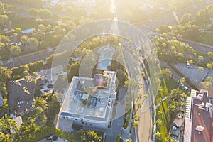 Aerial view of Beverly Hills neighborhood: Sunset Boulevard, North Beverly Drive and Rodeo Drive surrounded with palm