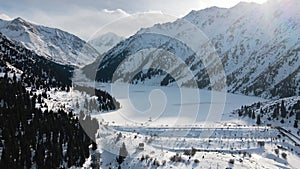 Aerial view of Big Almaty Lake with snow