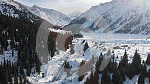 Aerial view of Big Almaty Lake with snow