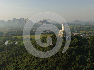 An aerial view of Big Buddha on the mountain stands prominently at Nong Hoi Temple in Ratchaburi near the Bangkok, Thailand.