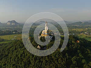 An aerial view of Big Buddha on the mountain stands prominently at Nong Hoi Temple in Ratchaburi near the Bangkok, Thailand.