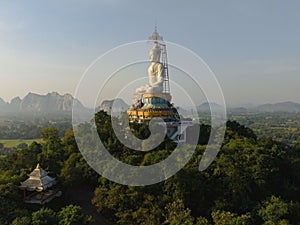 An aerial view of Big Buddha on the mountain stands prominently at Nong Hoi Temple in Ratchaburi near the Bangkok, Thailand.