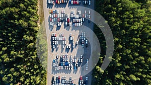 Aerial view of big parking lot of new cars. Automobile factory