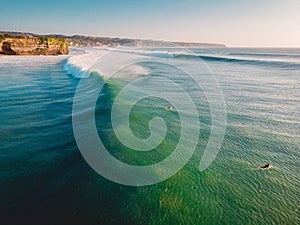 Aerial view of big perfect waves in ocean. Biggest wave and surfer in Bali