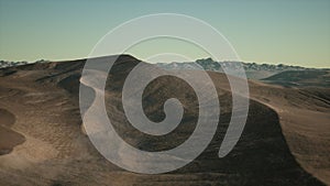 Aerial view on big sand dunes in Sahara desert at sunrise