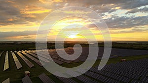 Aerial view of big sustainable electric power plant with rows of solar photovoltaic panels for producing clean