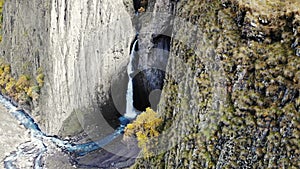 Aerial view of the big waterfall, Caucasus. Powerful stream of clean water runs from the melting glacier, falls down