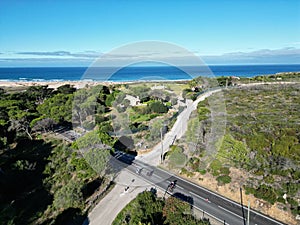 Aerial view of bikers riding on the highway on a sunny day