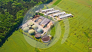 Aerial view of biogas plant near farm in countryside