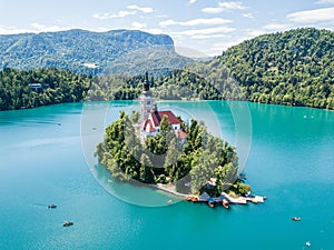 Aerial view of Bled Island or Blejski otok, Assumption of Mary church with a tower and spire, on mountain Bled lake, Slovenia. photo