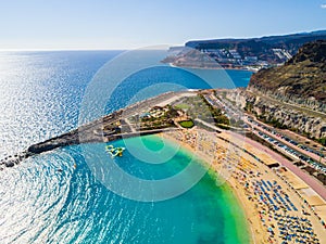 Aerial view of the blissful Playa de Amadores beach bay on Gran Canaria island, Spain