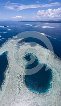 Aerial View of Blue Hole and Seascape in Raja Ampat photo