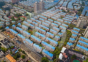 Aerial view of blue houses. Residential neighborhood. Urban housing development from above. Top view. Real estate in Shanghai City