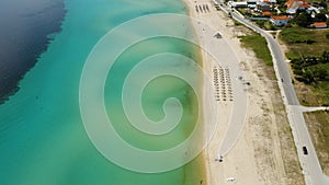 Aerial view of a blue ocean near a cliffy shore at daytime