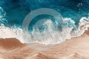 Aerial view of the blue ocean waves on the beach. Beautiful sandy beach with blue sea. Lonely sandy beach with beautiful waves.